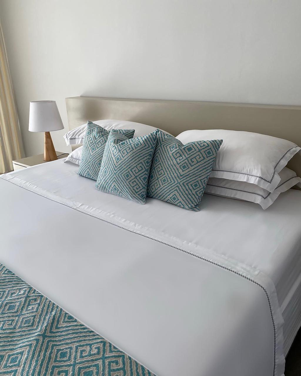 Bedroom with warm lighting and modern furnishings